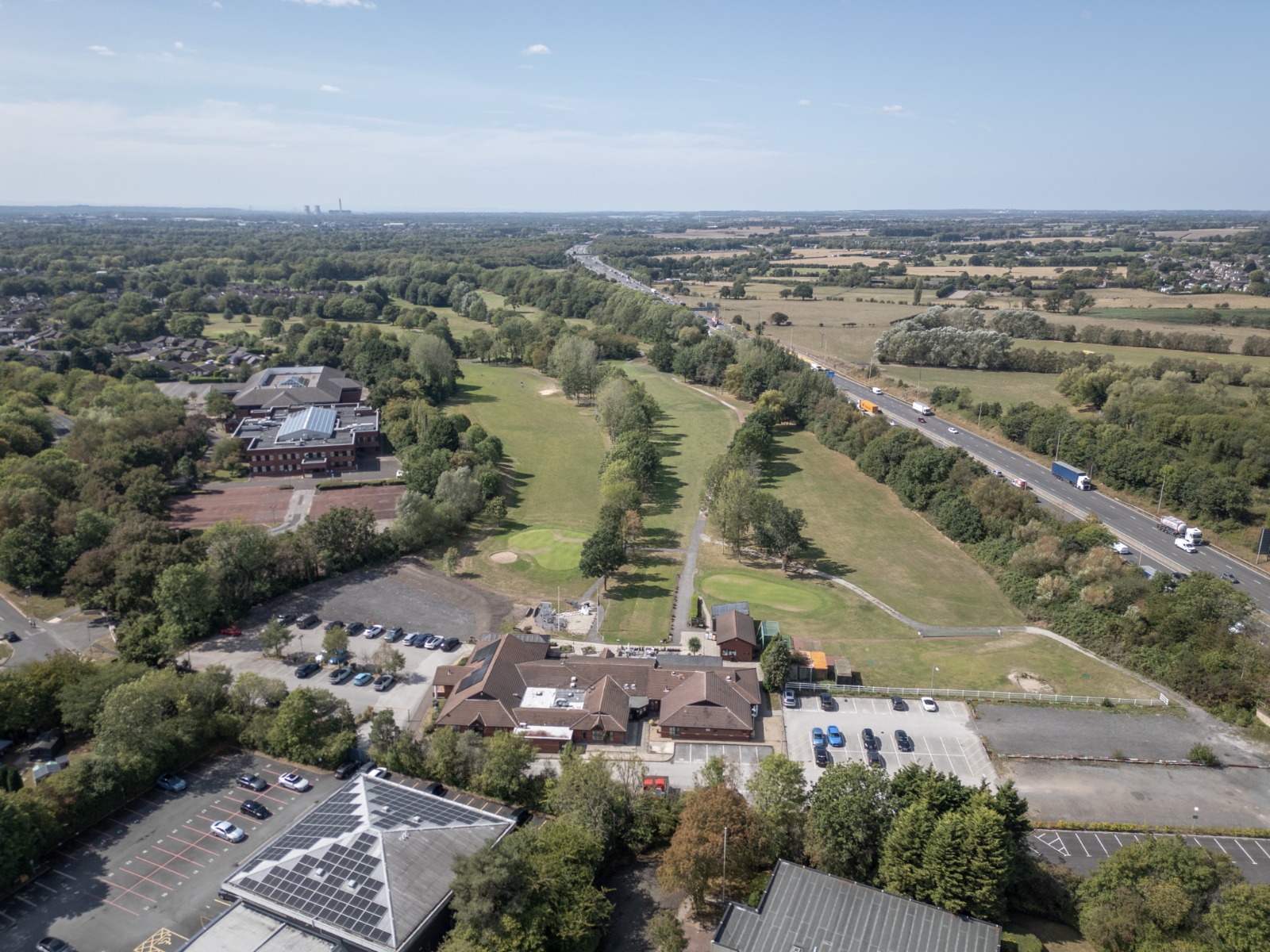 Same aerial site before the padel court domes were added